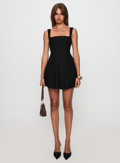 side view of model wearing Princess Polly Xanthus Mini Dress Black Square Neck 