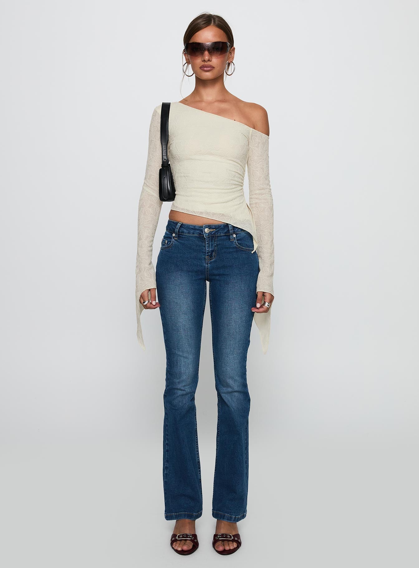 front view of model wearing Princess Polly Face Card Long Sleeve Top Cream Full Sleeves Asymmetric Neckline 