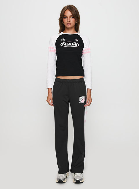 front view of model wearing Princess Polly Track Star Pants Black Low Rise Pants 