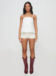 front view of model wearing Princess Polly Trapeze Strapless Top White Sleeveless Square Neck 