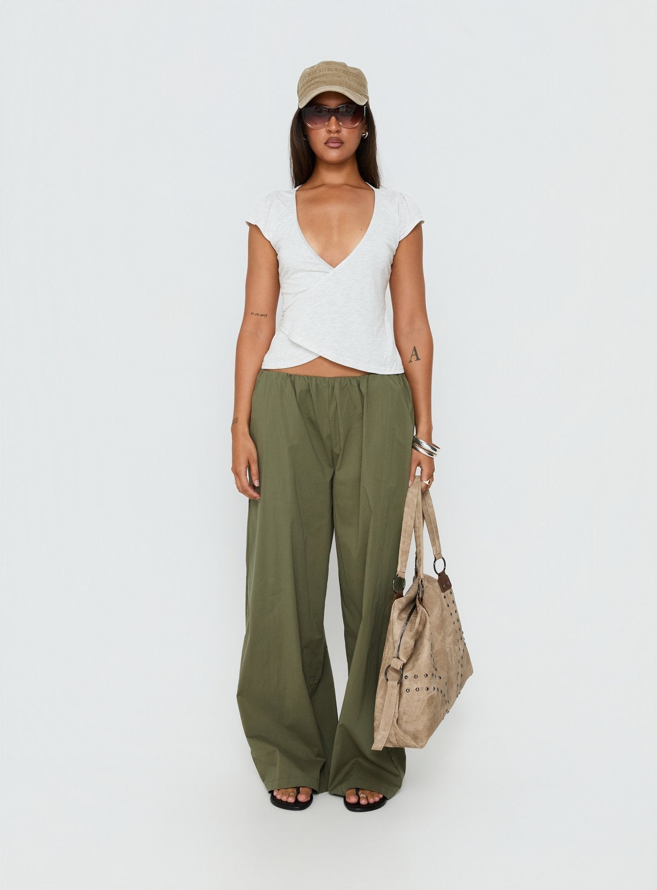 front view of model wearing Princess Polly Lunea Concealed Waistband Pants Khaki Low Rise Pants 