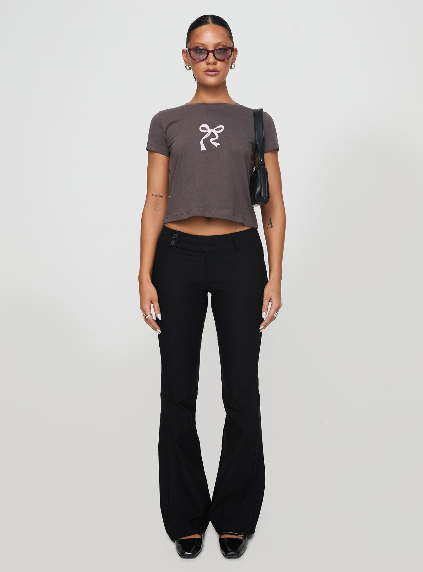 front view of model wearing Princess Polly Polly Bow Tee Charcoal Short Sleeves Crew Neck 