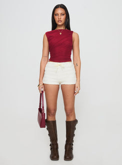 front view of model wearing Princess Polly Hasso Top Burgundy Sleeveless Crew Neck 