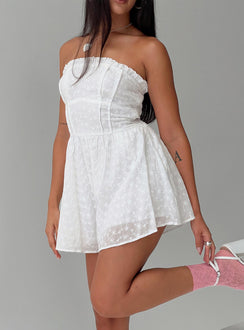 Strapless romper Embroidered flower print, inner silicone strip at bust, shirred elasticated band at back, frill detail at bust