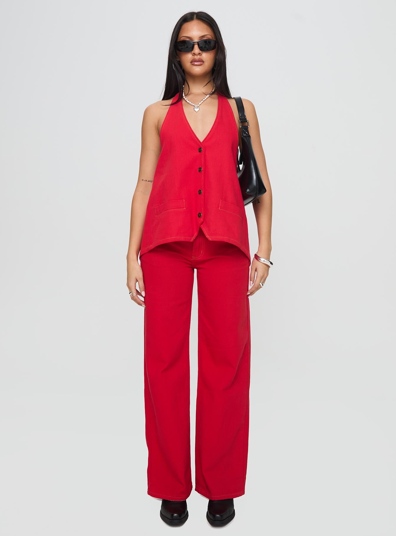 front view of model wearing Princess Polly Top Model Jeans Red Mid Rise 