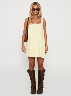 front view of model wearing Princess Polly Alanah Mini Dress Lemon Square Neck 