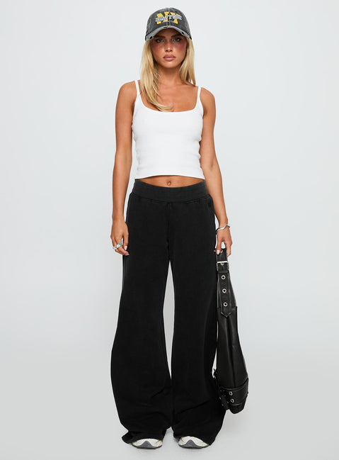 front view of model wearing Princess Polly Summits Flared Track Pants Washed Black High Waisted Pants 