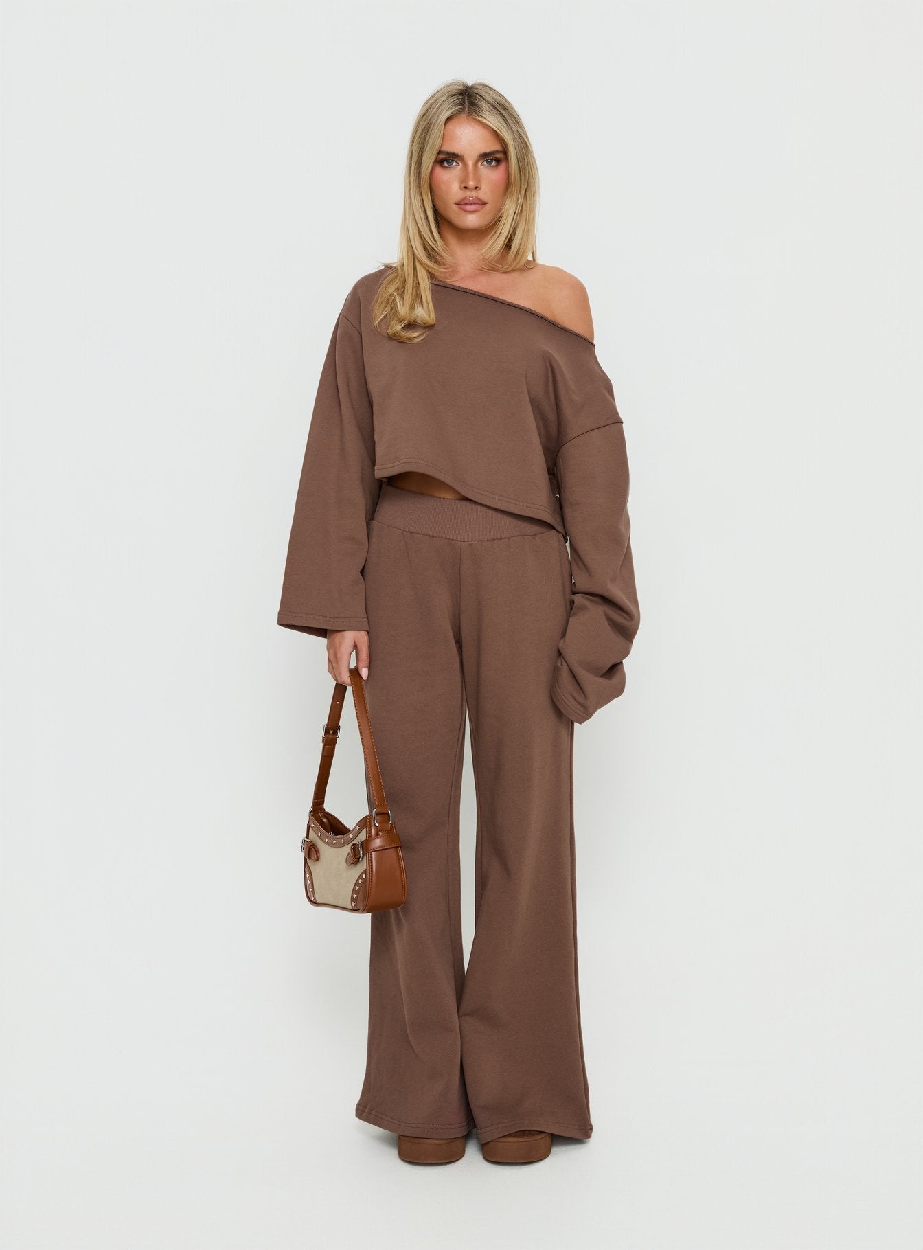 front view of model wearing Princess Polly Peaks Flared Track Pants Cocoa Mid Rise Pants 