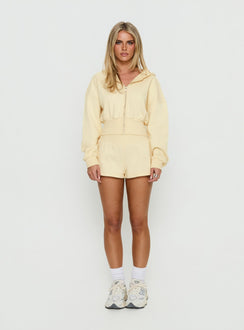 side view of model wearing Princess Polly Daytime Cropped Blouson Hoodie Buttercream Cropped Jumpers 