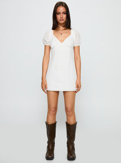 front view of model wearing Princess Polly Viella Broiderie Mini Dress White V-Neck 