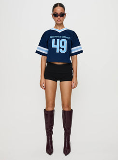 side view of model wearing Princess Polly USD Football Jersey Navy Half Sleeves V-Neck 