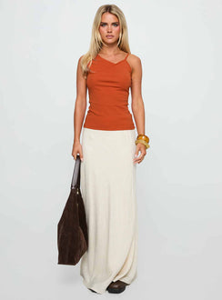 side view of model wearing Princess Polly Amarante Sleeveless Top Orange Sleeveless Asymmetric Neckline 