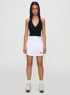   front view of model wearing Princess Polly USC Tennis Skort White 