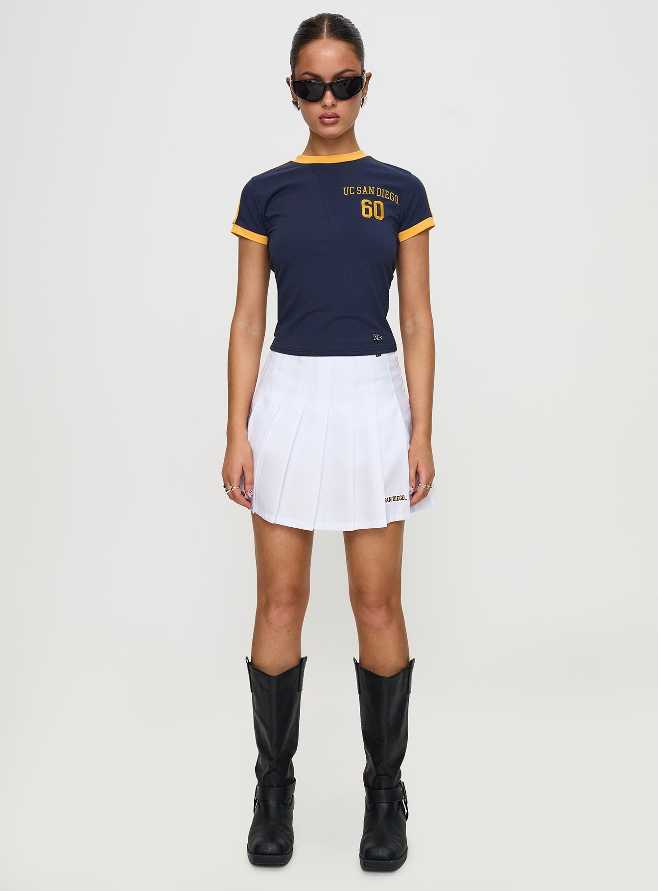   front view of model wearing Princess Polly UCSD Tennis Skort White 