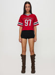 side view of model wearing Princess Polly SDSU Football Jersey Red Half Sleeves V-Neck 