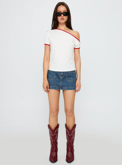   side view of model wearing Princess Polly Pitcher Denim Mini Skirt Mid Blue Wash Mini Skirts 