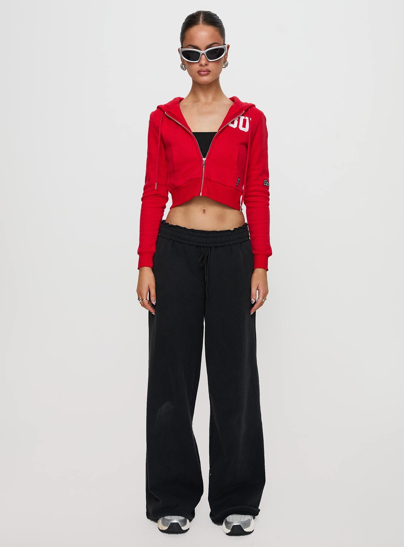 front view of model wearing Princess Polly BU MIA Zip Sweater Red cropped 