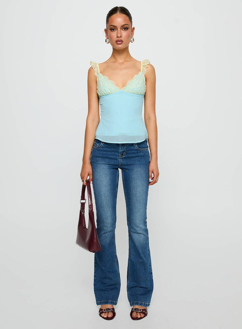 side view of model wearing Princess Polly Delvonte Top Blue / Yellow Sleeveless V-Neck 