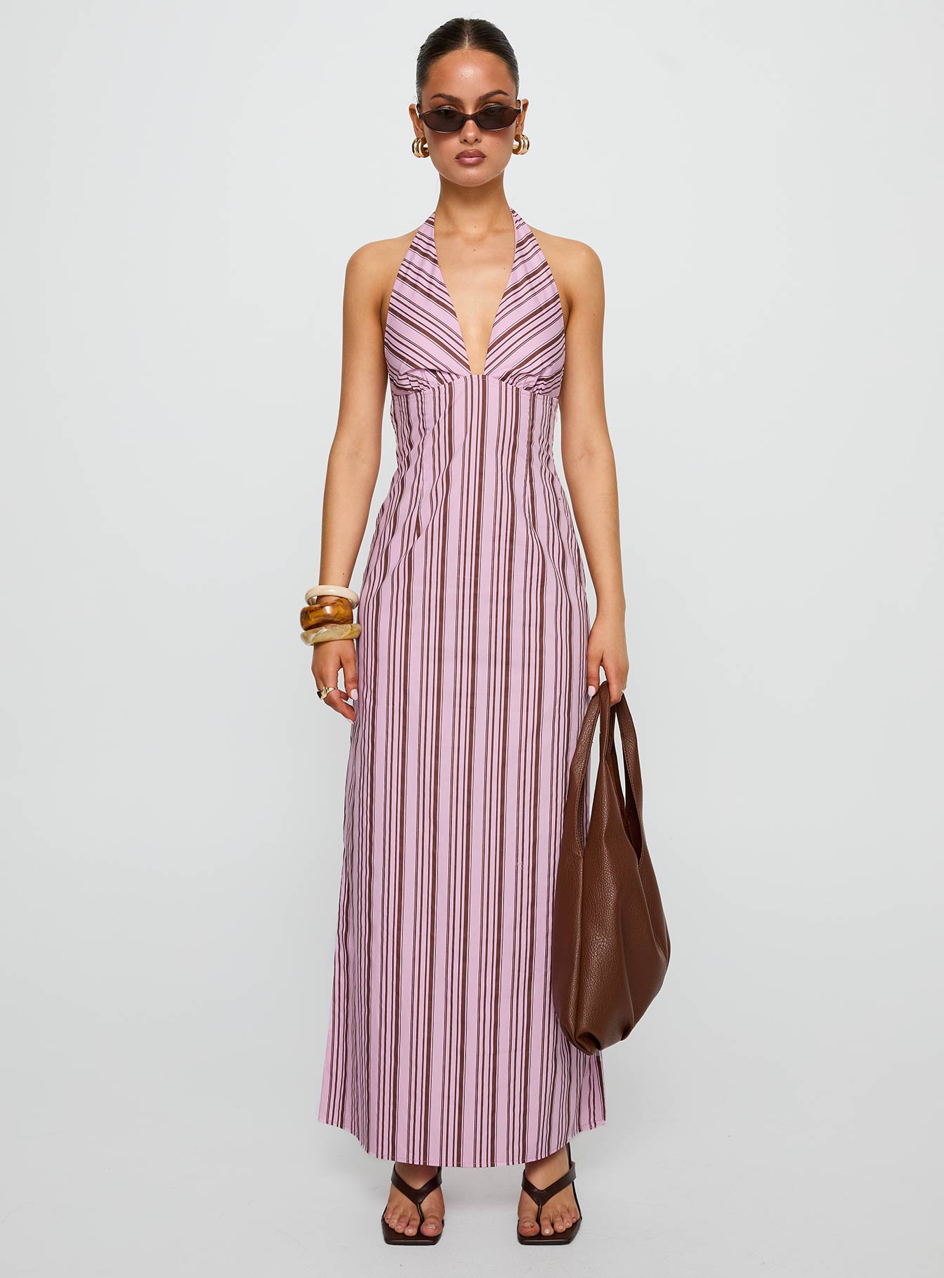 front view of model wearing Princess Polly Avrie Halter Maxi Dress Pink / Brown Stripe Plunger 