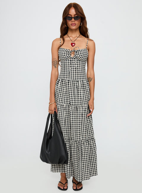 side view of model wearing Princess Polly Avaleine Tiered Maxi Dress Black / White Check Sweetheart Neckline 