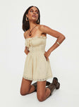 Strapless playsuit  Lace details, ruffle neckline, adjustable tie at neckline, shirred back, twin hip pockets 