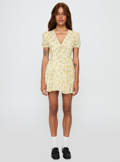 front view of model wearing Princess Polly Ethelyn Mini Dress Yellow Floral V-Neck 