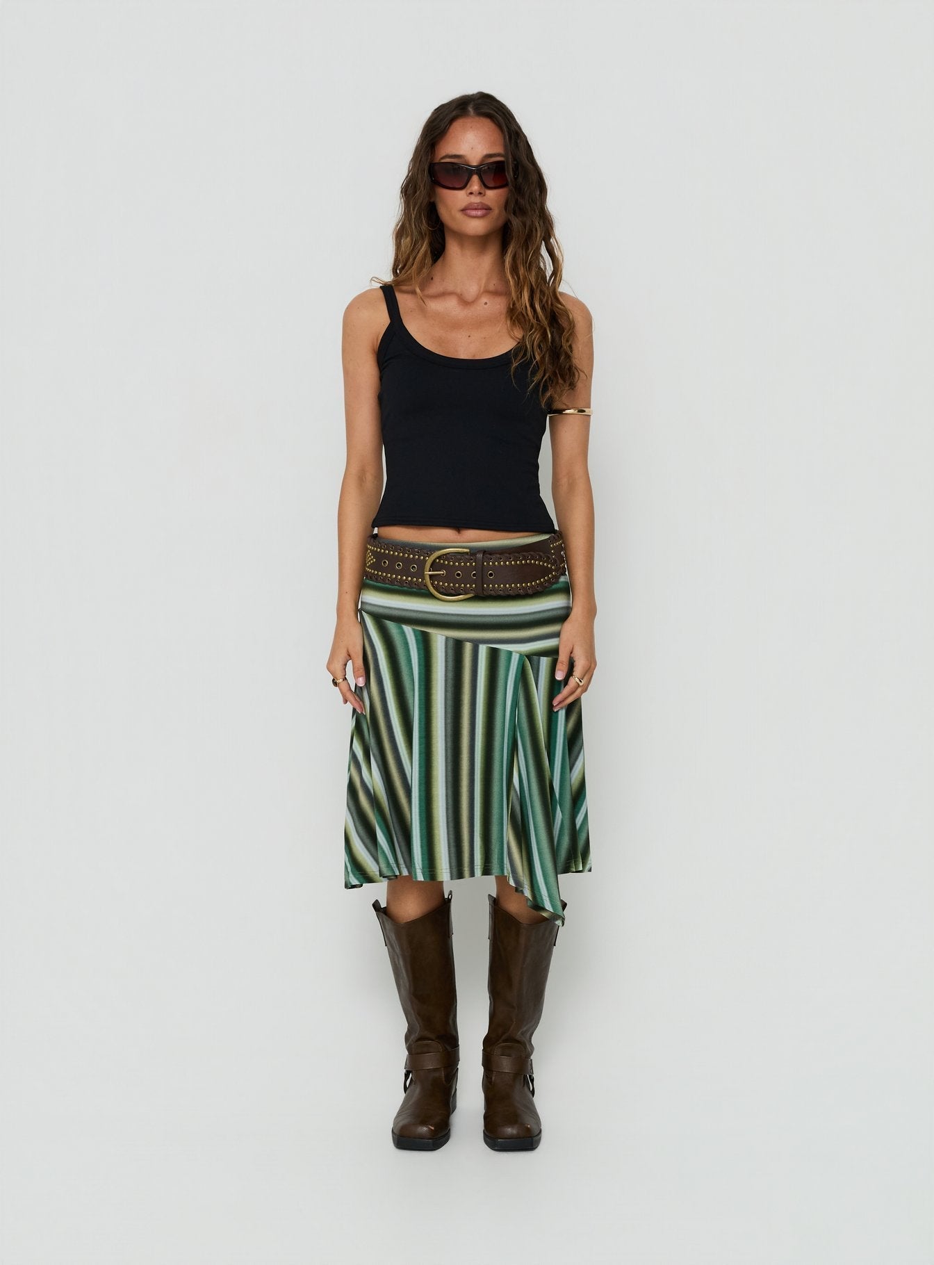 Showcasing the Desidera Asymmetrical Midi Skirt Blue Multi Stripe in womens-skirts with flared fitted design front view of model wearing Princess Polly
