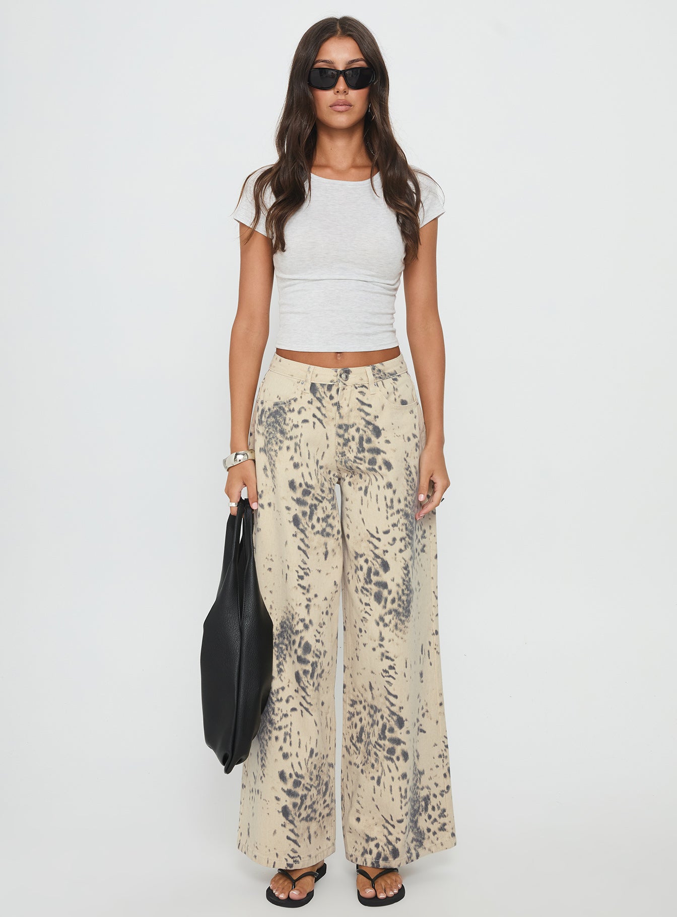 front view of model wearing Princess Polly Naylor Mid Rise Wide Leg Jeans Animal Spot Mid Rise Jeans 
