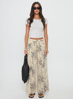 front view of model wearing Princess Polly Naylor Mid Rise Wide Leg Jeans Animal Spot Mid Rise Jeans 