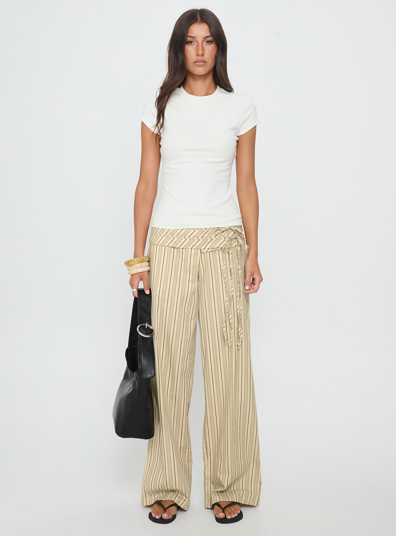 front view of model wearing Princess Polly Seneca Wrap Pant Beige Stripe Mid Rise Pants 