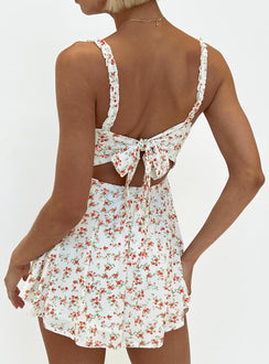 Romper Floral print Ruffle detailing Open back with tie Invisible zip at back Elasticated backband Fixed straps Fully lined
