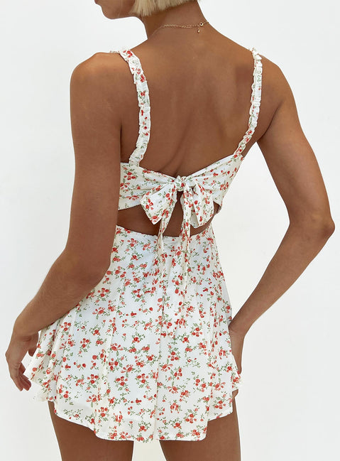 Romper Floral print Ruffle detailing Open back with tie Invisible zip at back Elasticated backband Fixed straps Fully lined