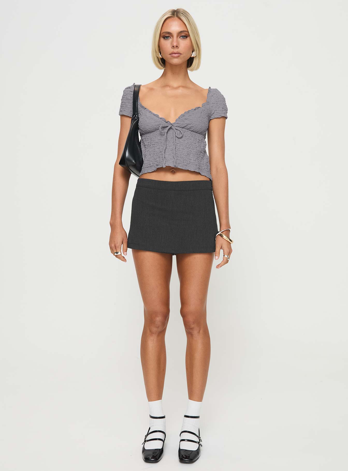 front view of model wearing Princess Polly Kellan Cap Sleeve Top Blue Short Sleeves Plunger 