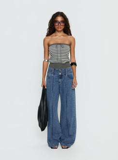 side view of model wearing Princess Polly Hannalee Low Rise Wide Leg Jeans Mid Blue Wash Low Rise Jeans 