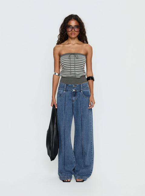 side view of model wearing Princess Polly Hannalee Low Rise Wide Leg Jeans Mid Blue Wash Low Rise Jeans 