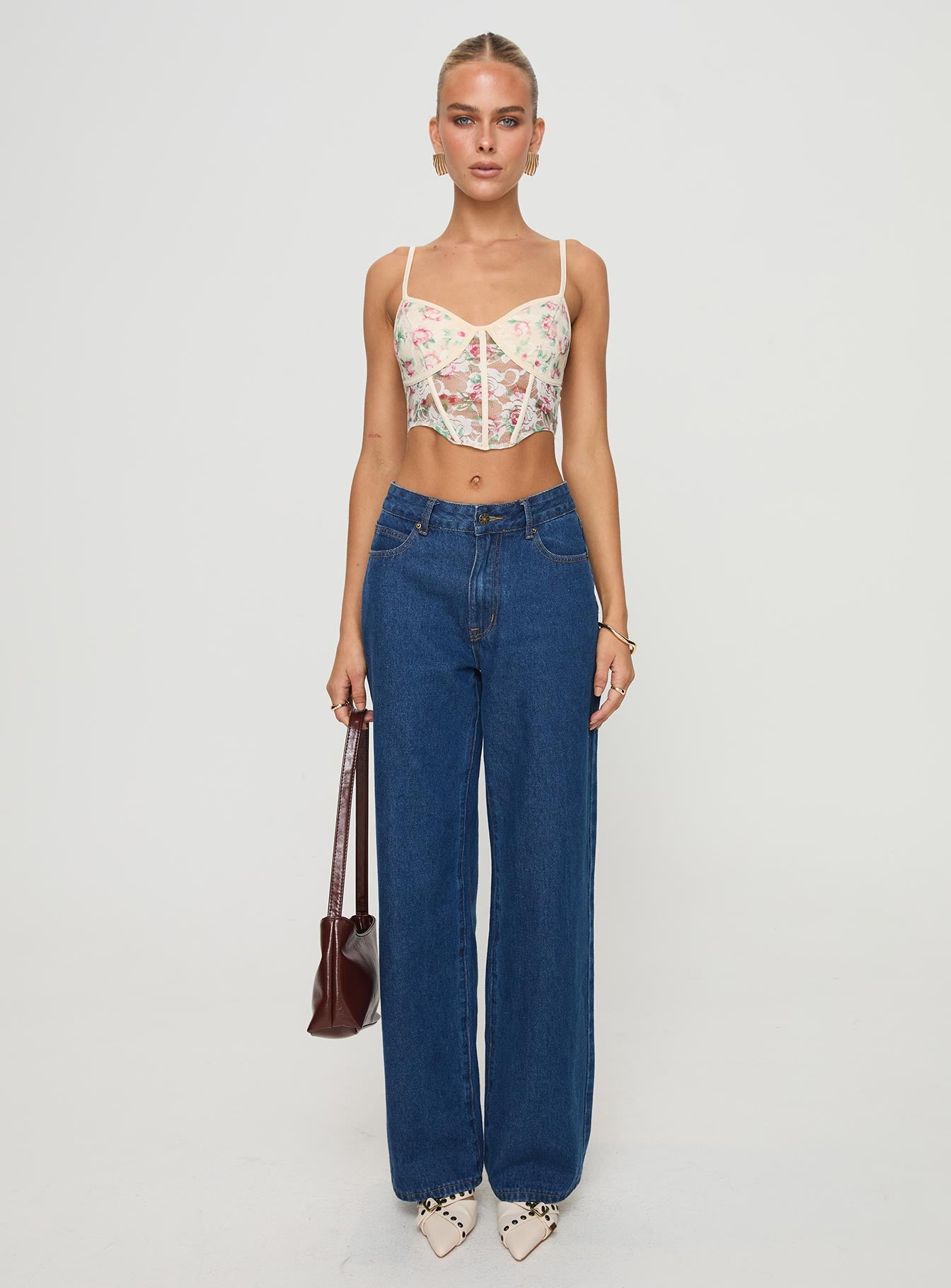 front view of model wearing Princess Polly Romania Top Cream / Floral Sleeveless Sweetheart 