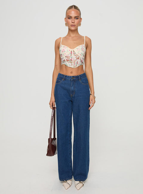 front view of model wearing Princess Polly Romania Top Cream / Floral Sleeveless Sweetheart 