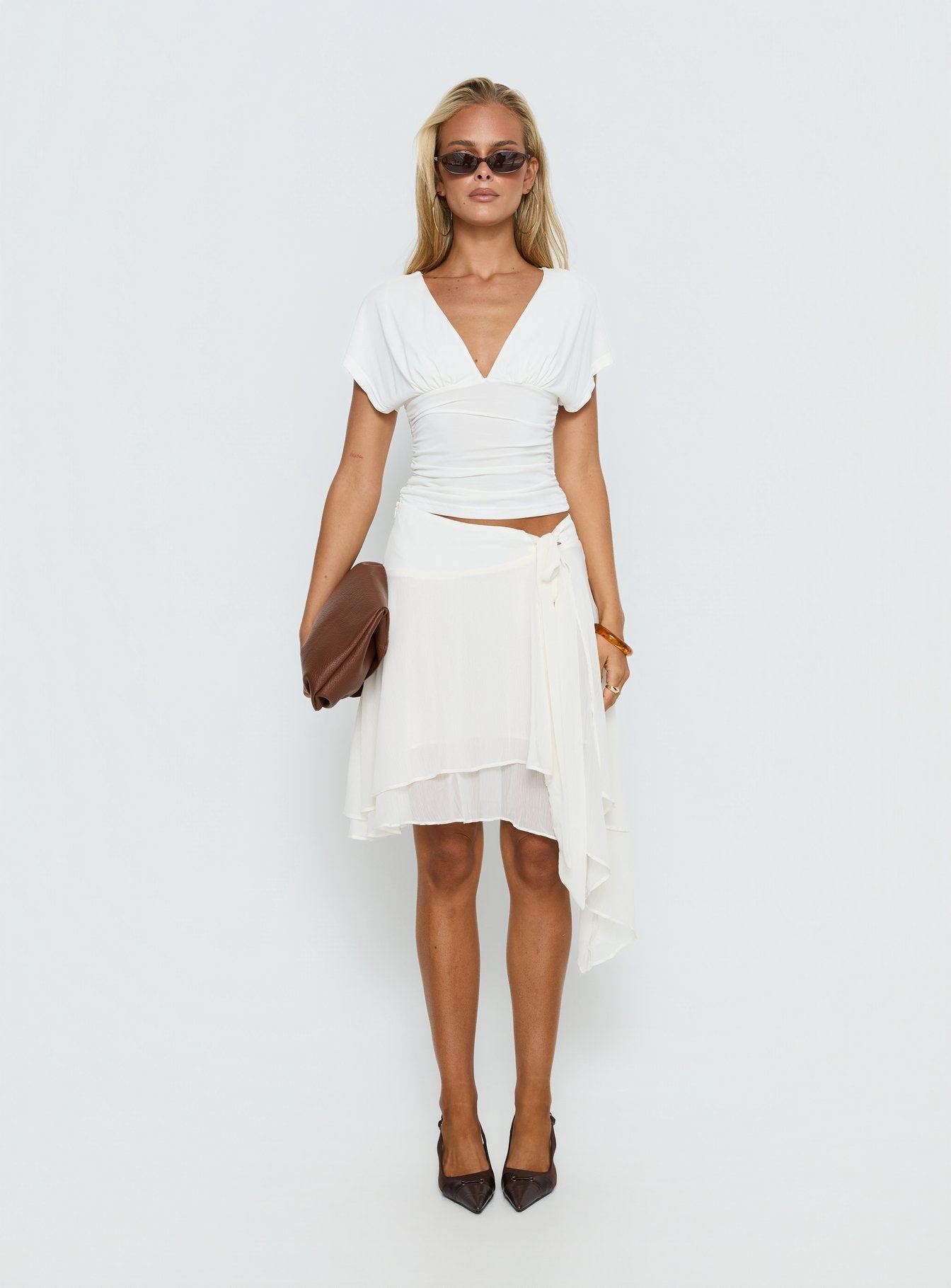   side view of model wearing Princess Polly Ophella Tie Waist Chiffon Midi Skirt Cream 