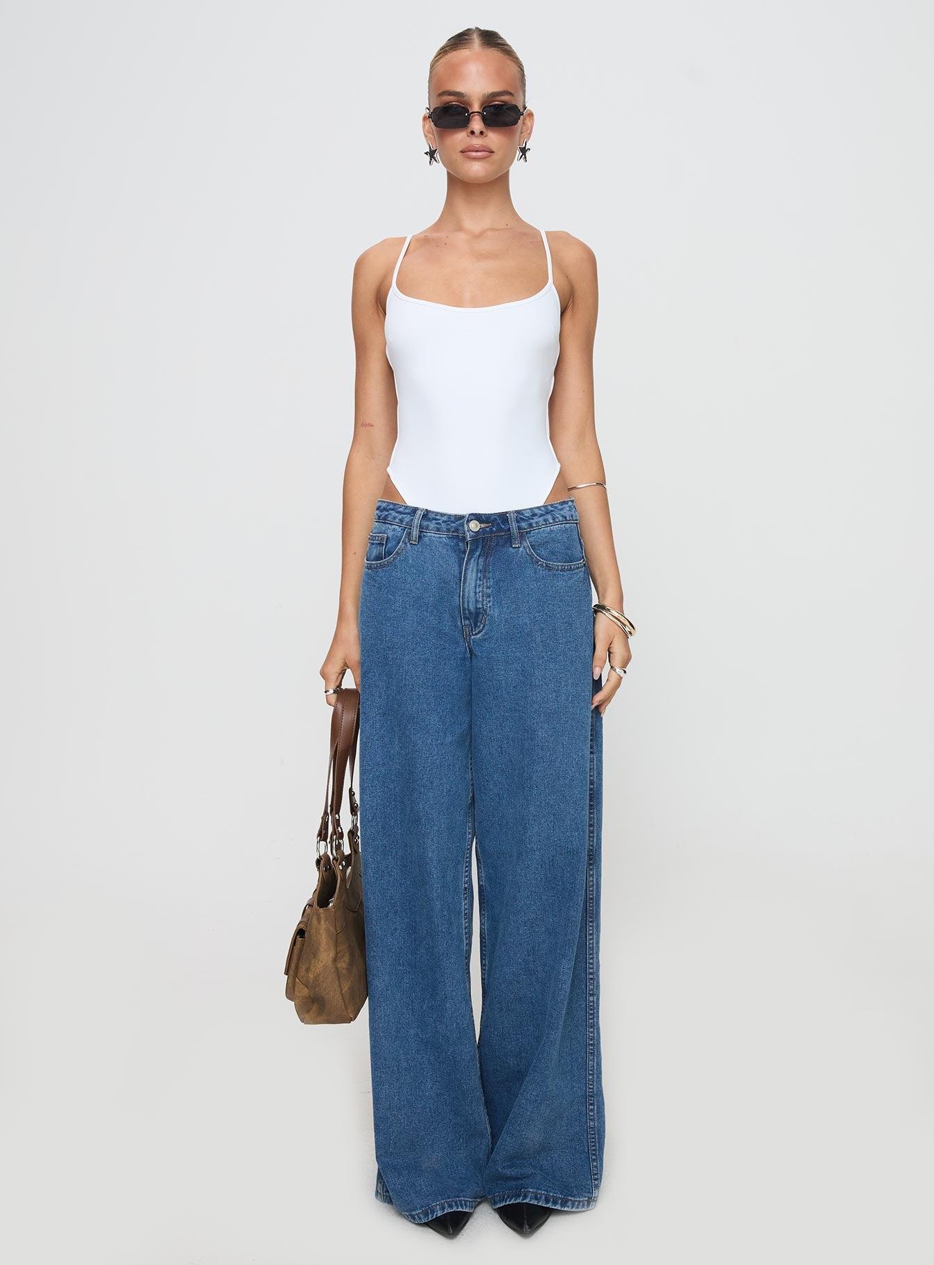 side view of model wearing Princess Polly All Tied Up Bodysuit White Tall Sleeveless 