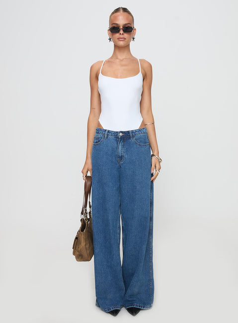 side view of model wearing Princess Polly All Tied Up Bodysuit White Tall Sleeveless 