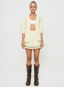 back view of model wearing Princess Polly Jamari Linen Blend Shorts Cream / Brown High Waisted Shorts 