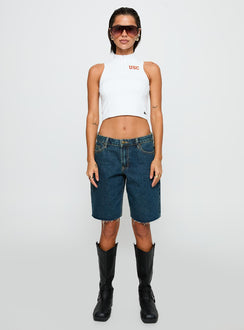 side view of model wearing Princess Polly USC Belle Tank Top White Sleeveless High Neck 