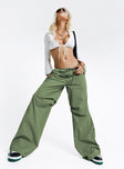 Front view of model wearing  front Princess Polly  Snow Parachute Pants Green