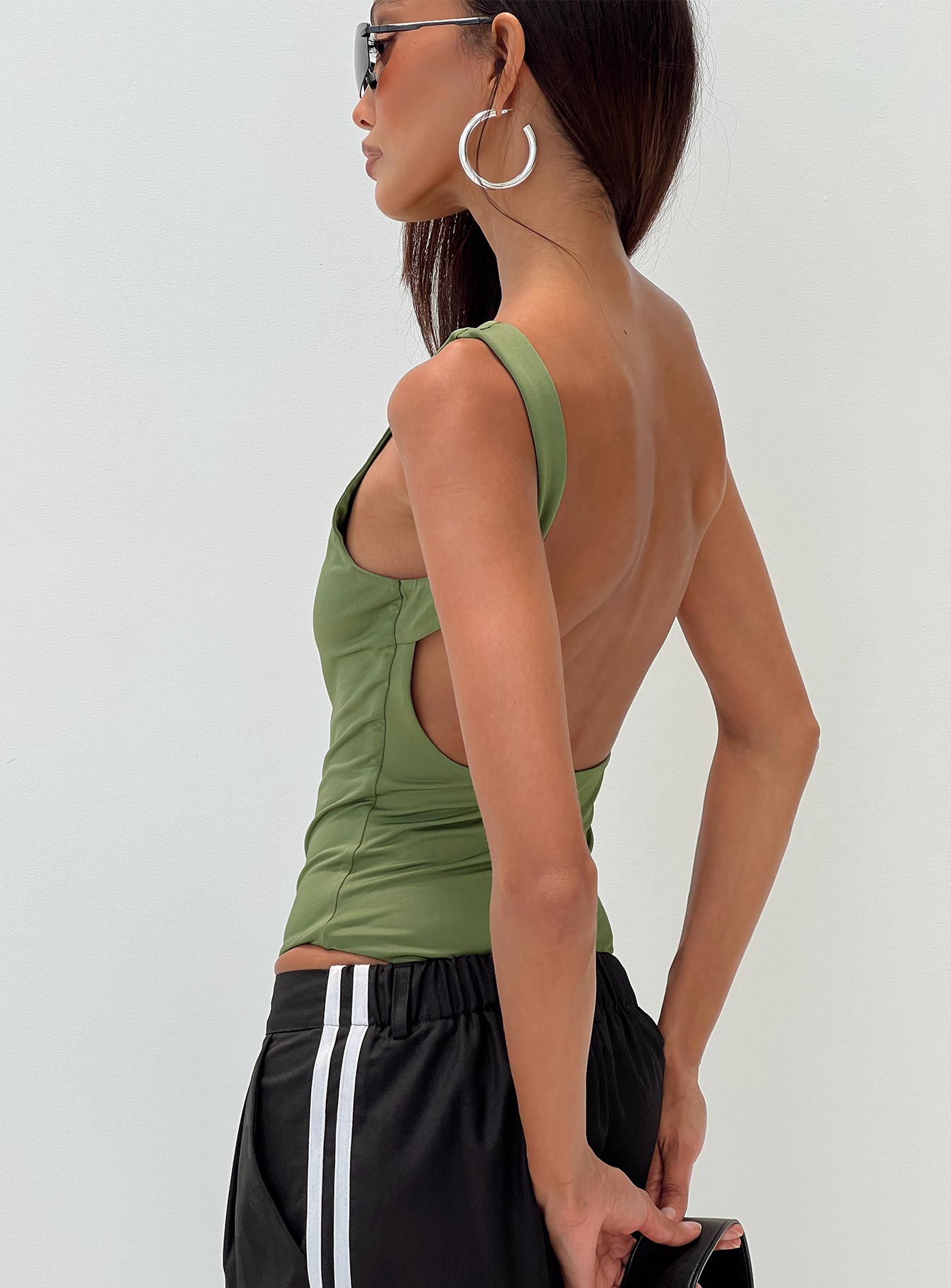 back view of model wearing Princess Polly Coomba Backless Bodysuit Green Sleeveless Boat Neck 