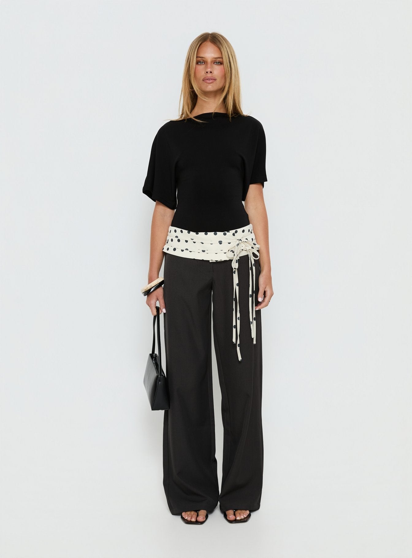 front view of model wearing Princess Polly Seneca Wrap Pants Charcoal Polka Dot Mid Rise Pants 