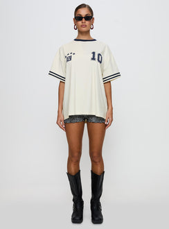 side view of model wearing Princess Polly Cornwall Football Jersey Cream Half Sleeves Crew Neck 