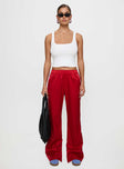 front view of model wearing Princess Polly Travalta Satin Track Pant Red Low Rise Pants 