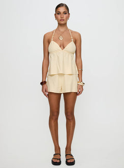 front view of model wearing Princess Polly Solid Gold Shorts Lemon High Waisted Shorts 