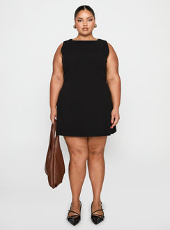 side view of model wearing Princess Polly Anse Mini Dress Black Curve Crew Neck 