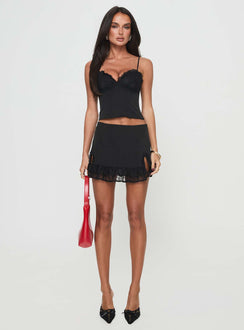   front view of model wearing Princess Polly Ferran Mini Skirt Black Mini Skirts 